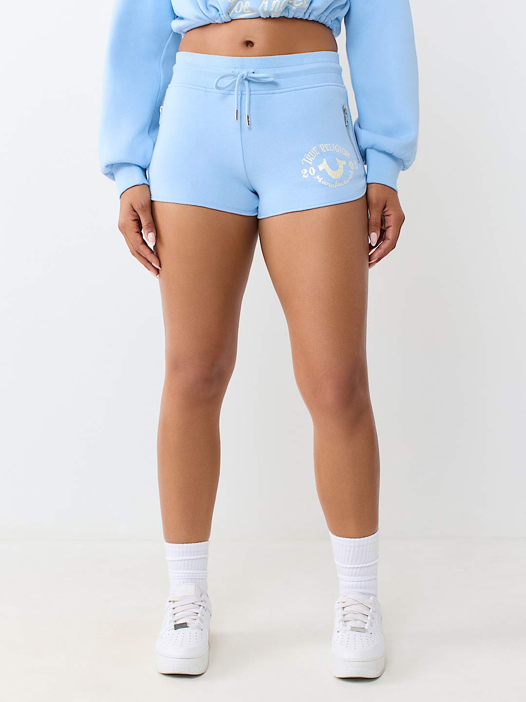 ZIP POCKET DOLPHIN HEM HOT SHORT