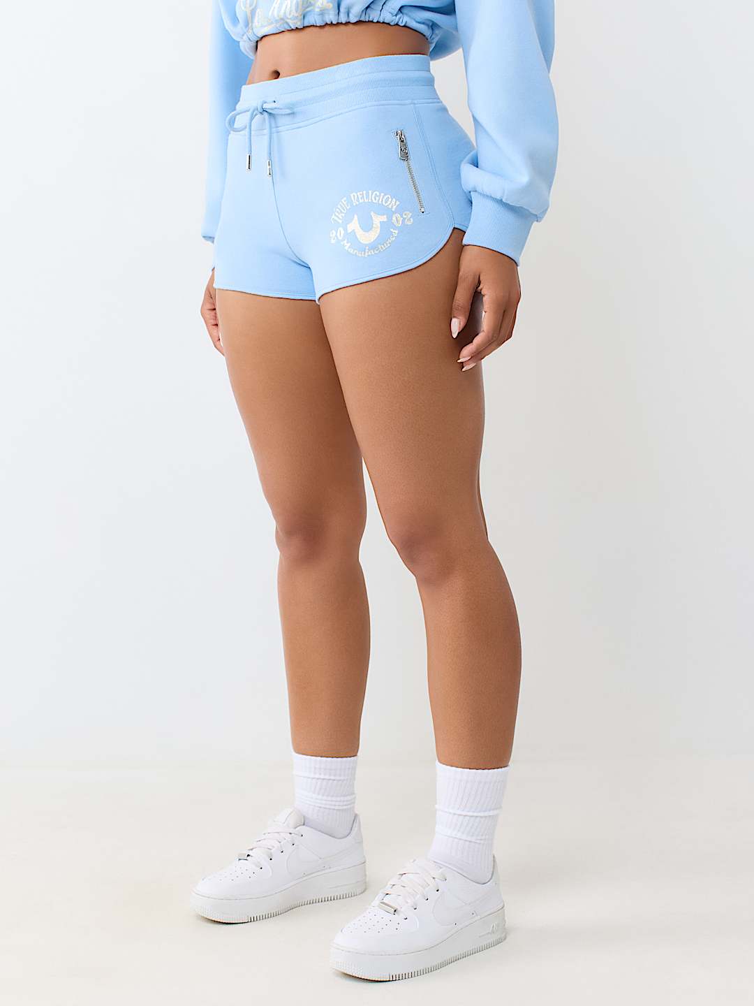 ZIP POCKET DOLPHIN HEM HOT SHORT