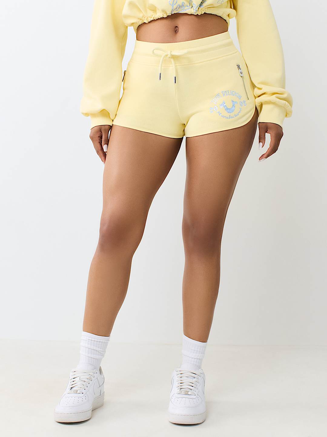 ZIP POCKET DOLPHIN HEM HOT SHORT