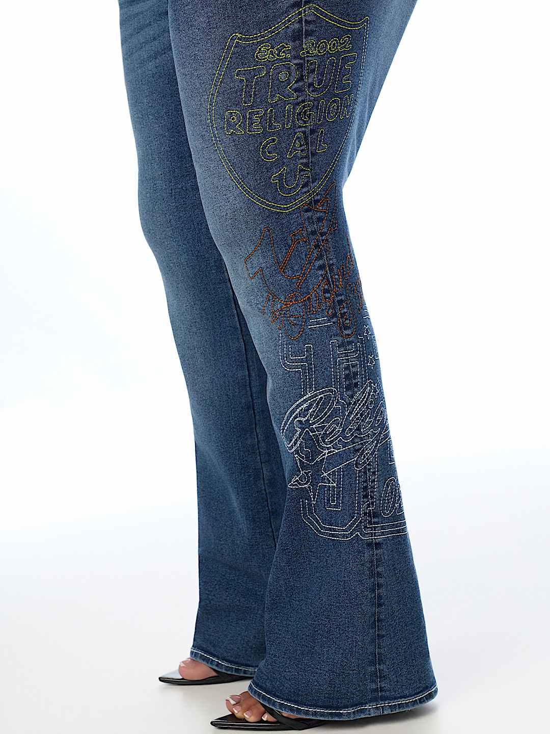 PLUS BECCA MID RISE EMBROIDERED BIG T FLAP BOOTCUT JEAN