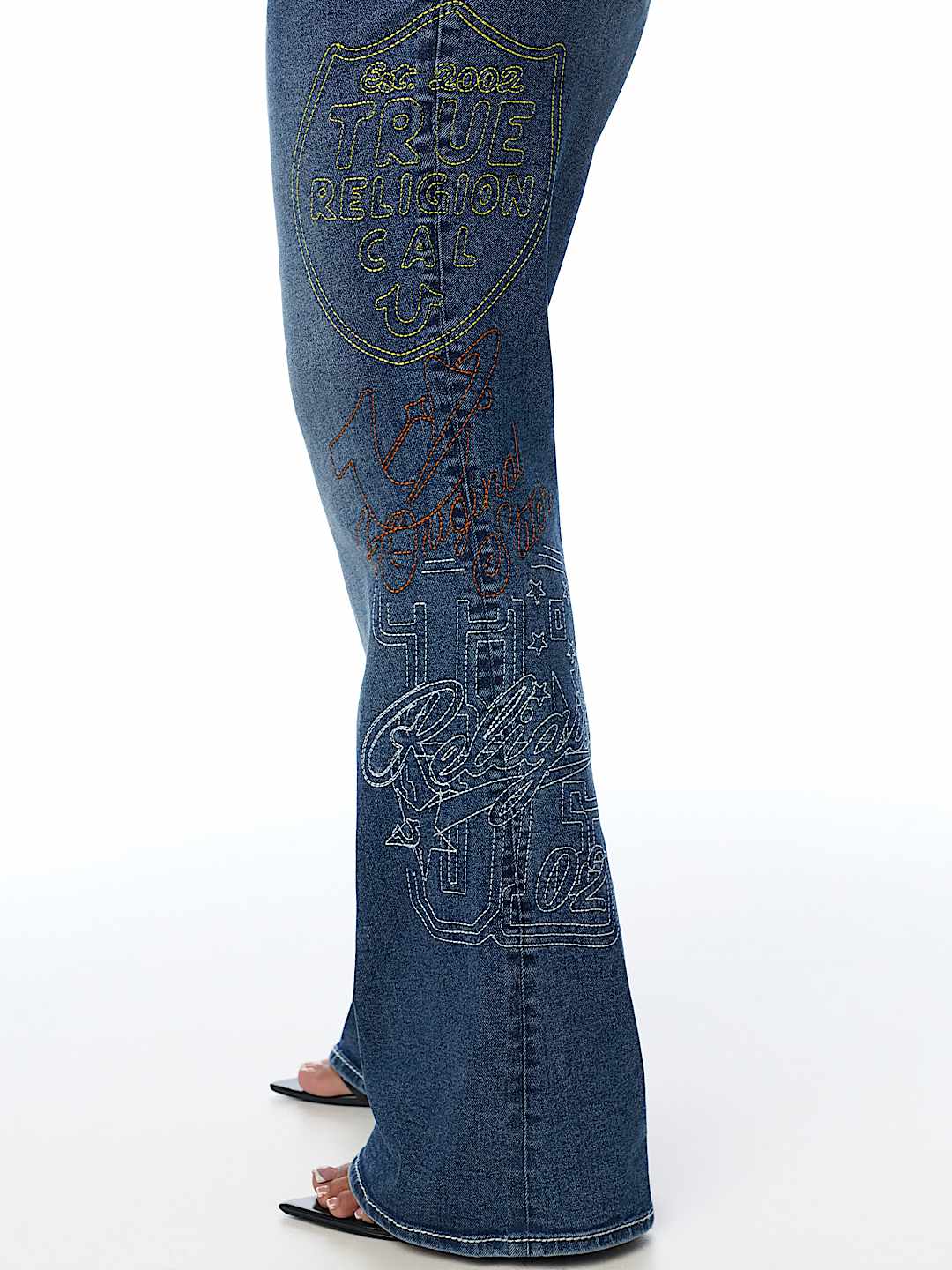 PLUS BECCA MID RISE EMBROIDERED BIG T FLAP BOOTCUT JEAN