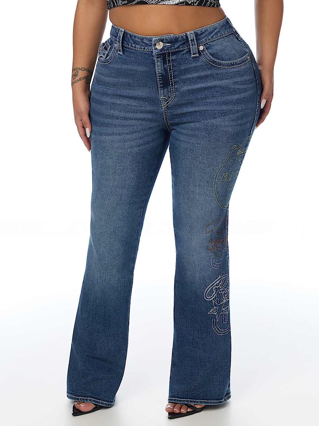 PLUS BECCA MID RISE EMBROIDERED BIG T FLAP BOOTCUT JEAN
