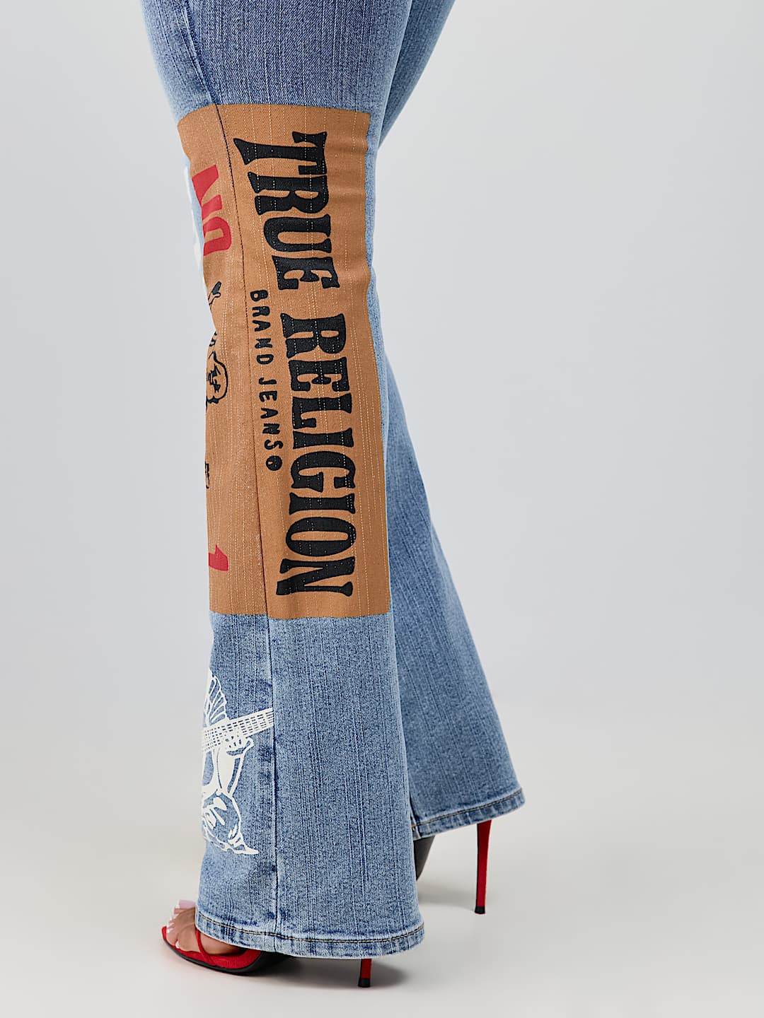 BECCA MID RISE PRINT FLAP BOOTCUT JEAN