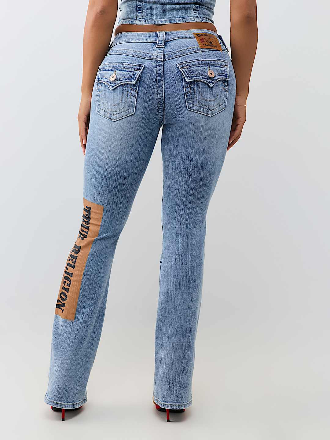 BECCA MID RISE PRINT FLAP BOOTCUT JEAN