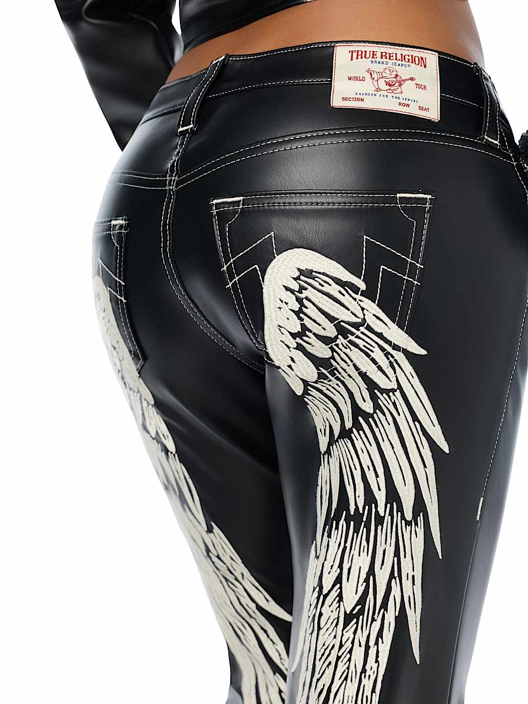 BECCA MID RISE EMBROIDERED WING FAUX LEATHER BOOTCUT JEAN