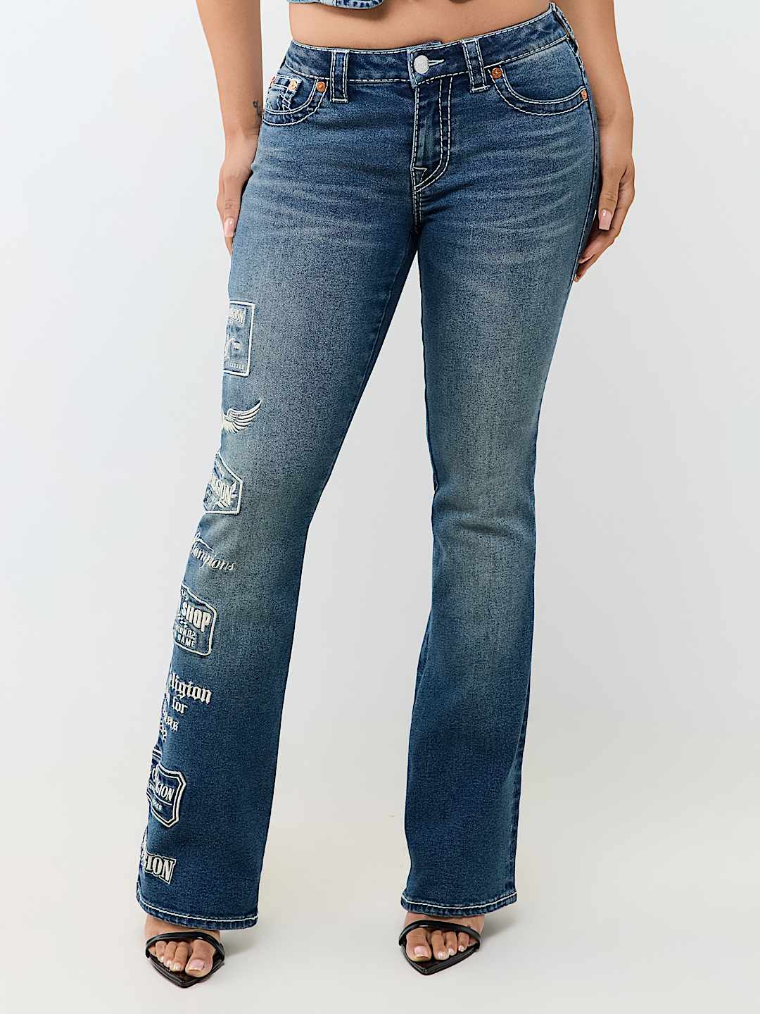 BECCA MID RISE EMBROIDERED LOGO BIG T BOOTCUT JEAN