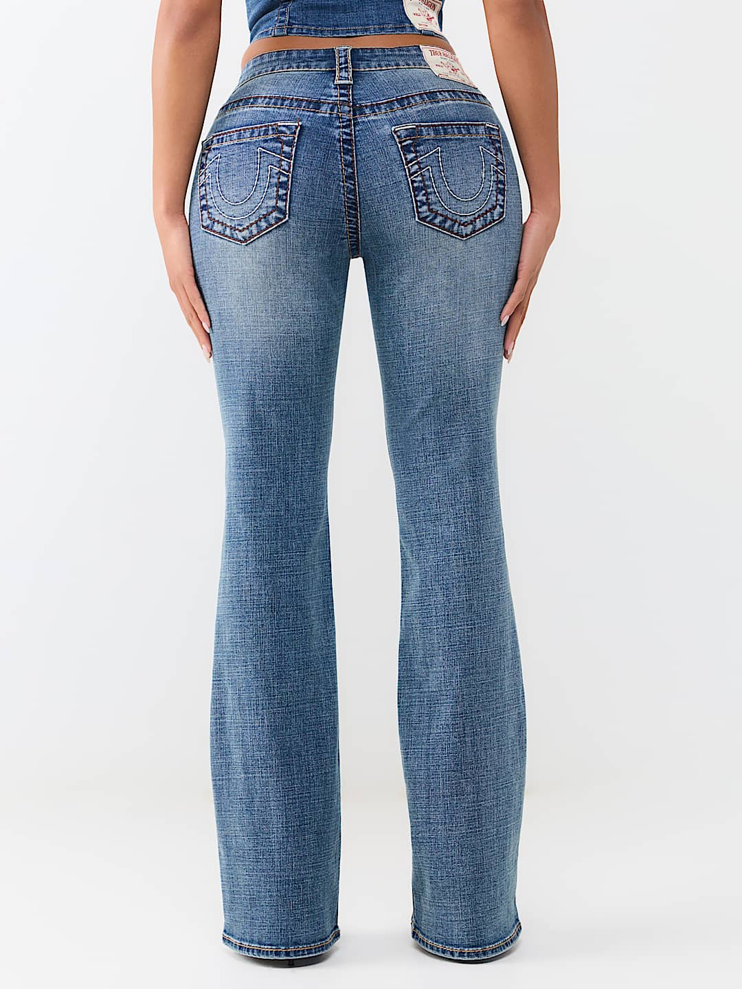 BECCA MID RISE BIG T BOOTCUT JEAN