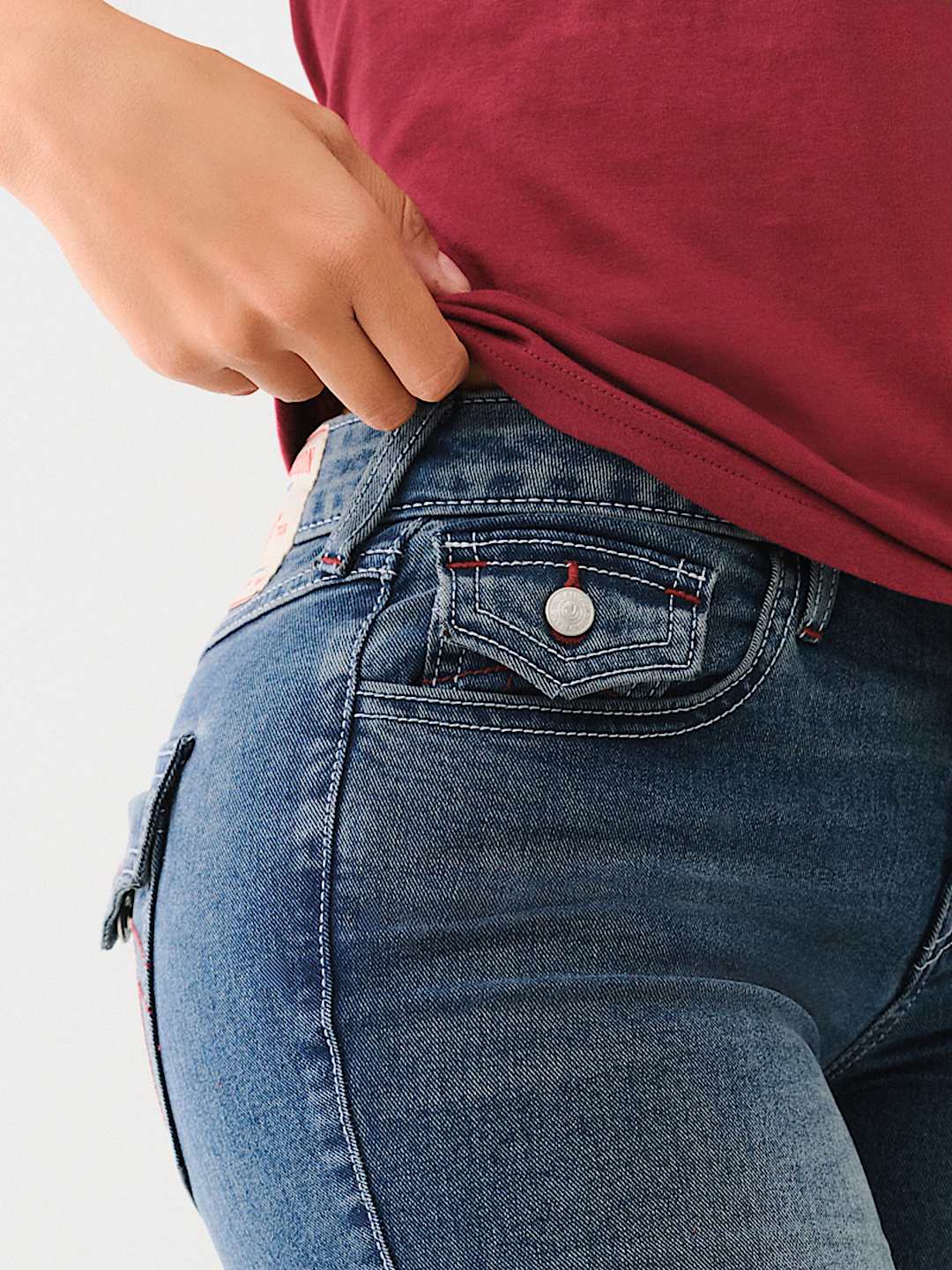 JENNIE MID RISE FLAP SKINNY JEAN