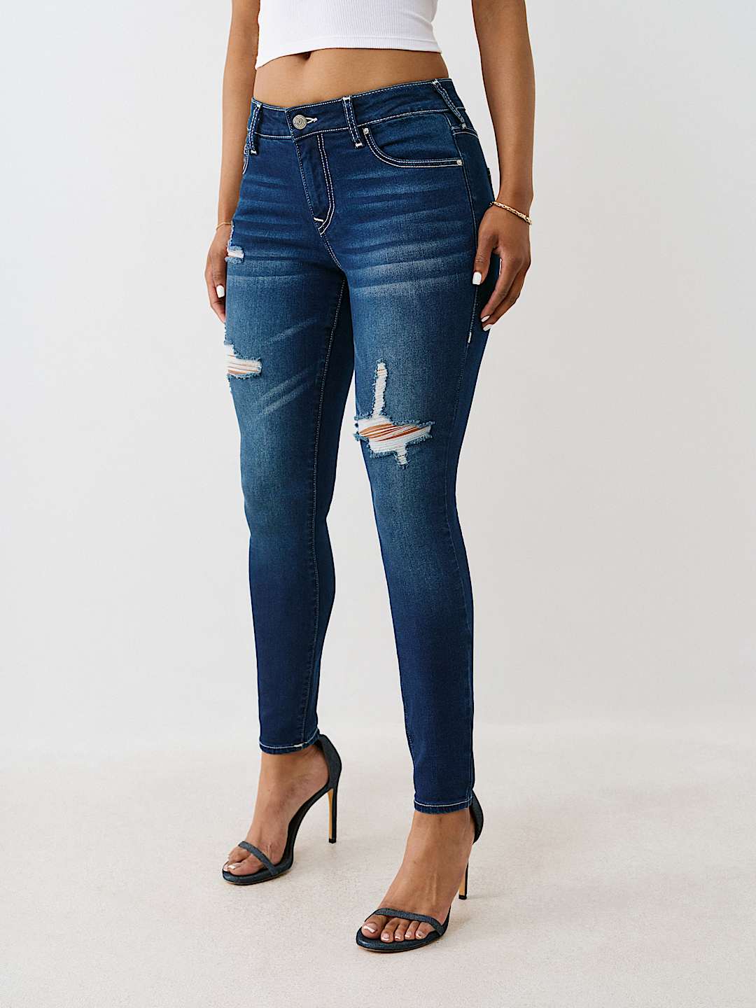 JENNIE MID RISE DISTRESSED CURVY SKINNY JEAN