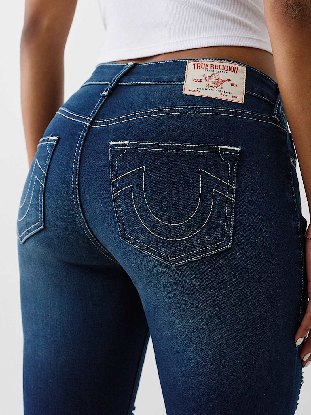JENNIE MID RISE DISTRESSED CURVY SKINNY JEAN