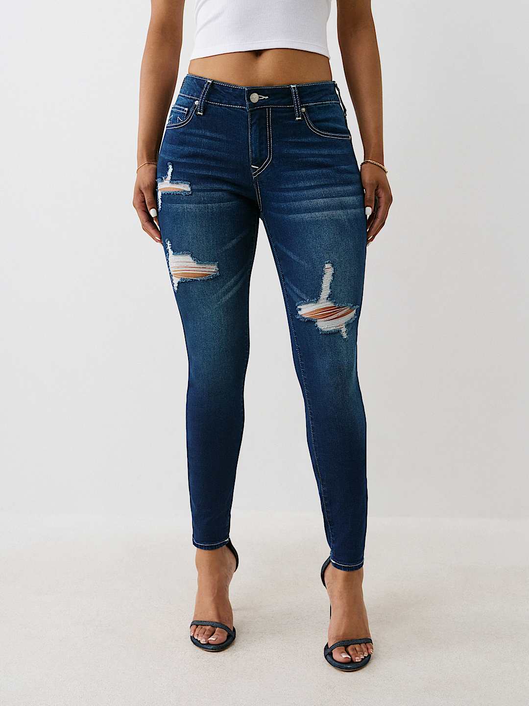 JENNIE MID RISE DISTRESSED CURVY SKINNY JEAN
