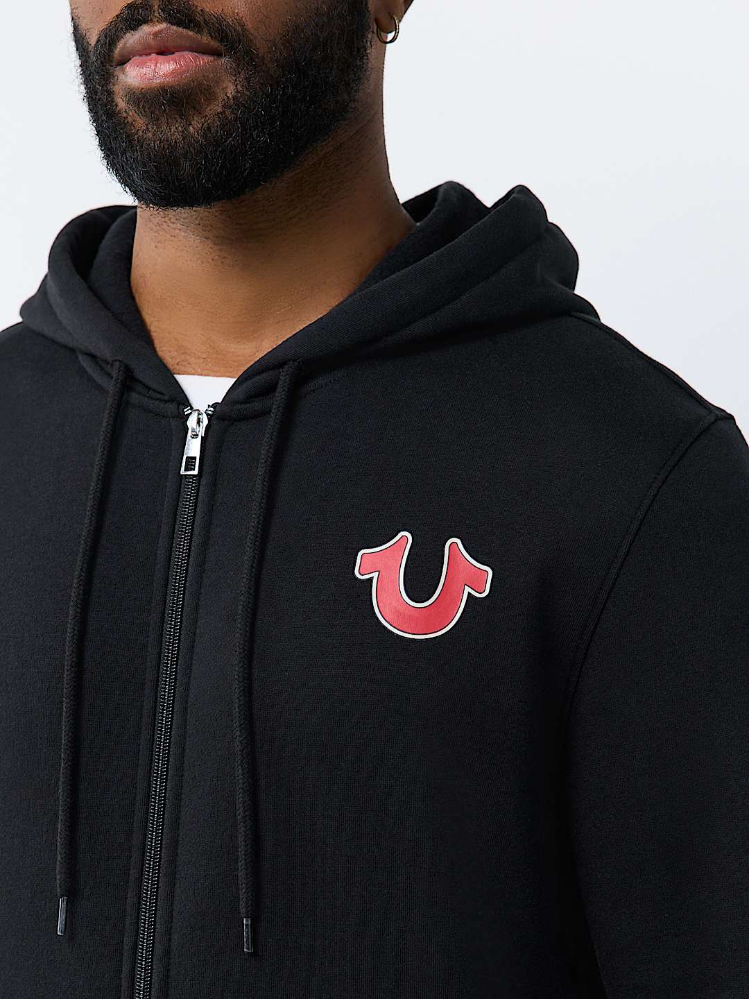 SUDADERA CON CAPUCHA Y CIERRE CON LETRERO DE TRUE