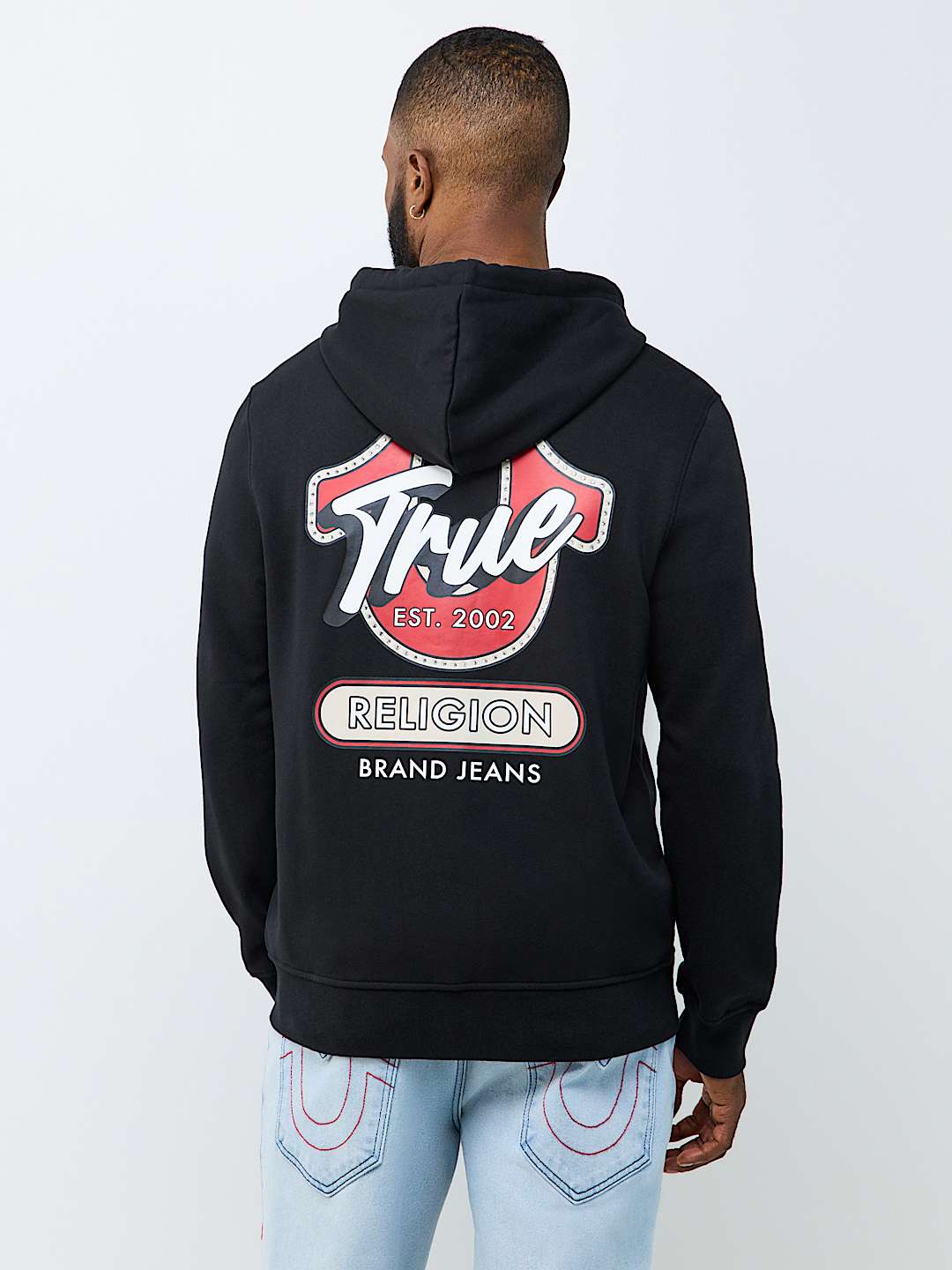 SUDADERA CON CAPUCHA Y CIERRE CON LETRERO DE TRUE