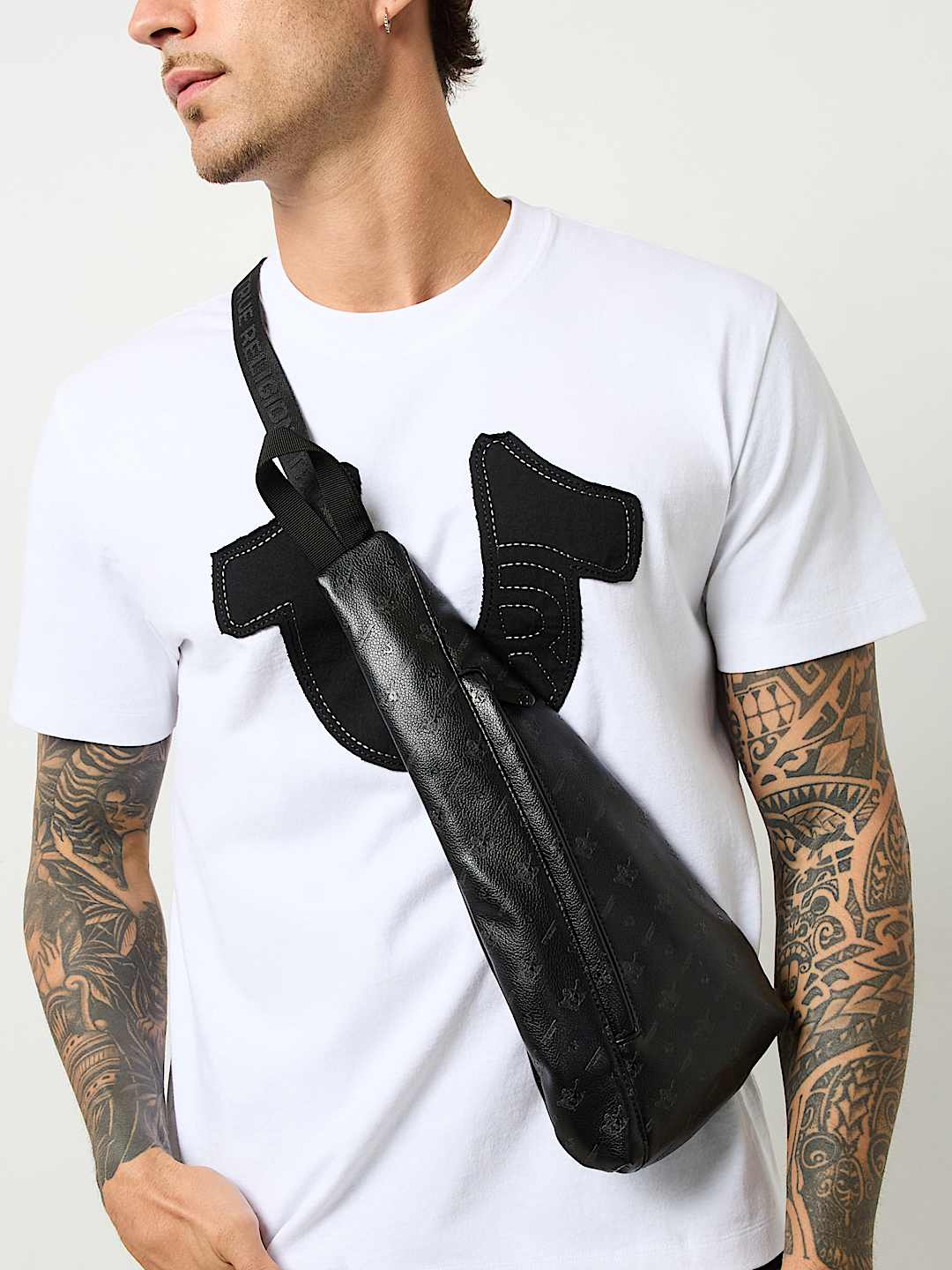 PEBBLED MONOGRAM SLING BAG - Black | True Religion