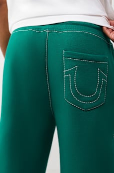 PANTALONES DEPORTIVOS HOLGADOS BIG T CON ESCUDO DE TR, image 3