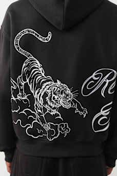CHANDAIL &Agrave; CAPUCHON AMPLE AVEC LOGO DE TIGRE ET INSCRIPTION