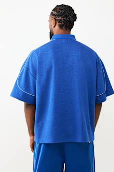 MULTI-LOGO OVERSIZED POLO SHIRT