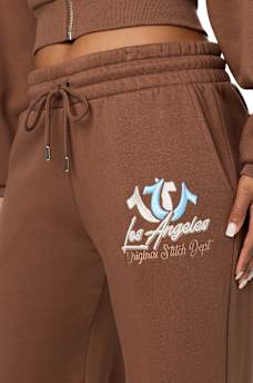 EMBROIDERED MID RISE WIDE LEG SWEATPANT